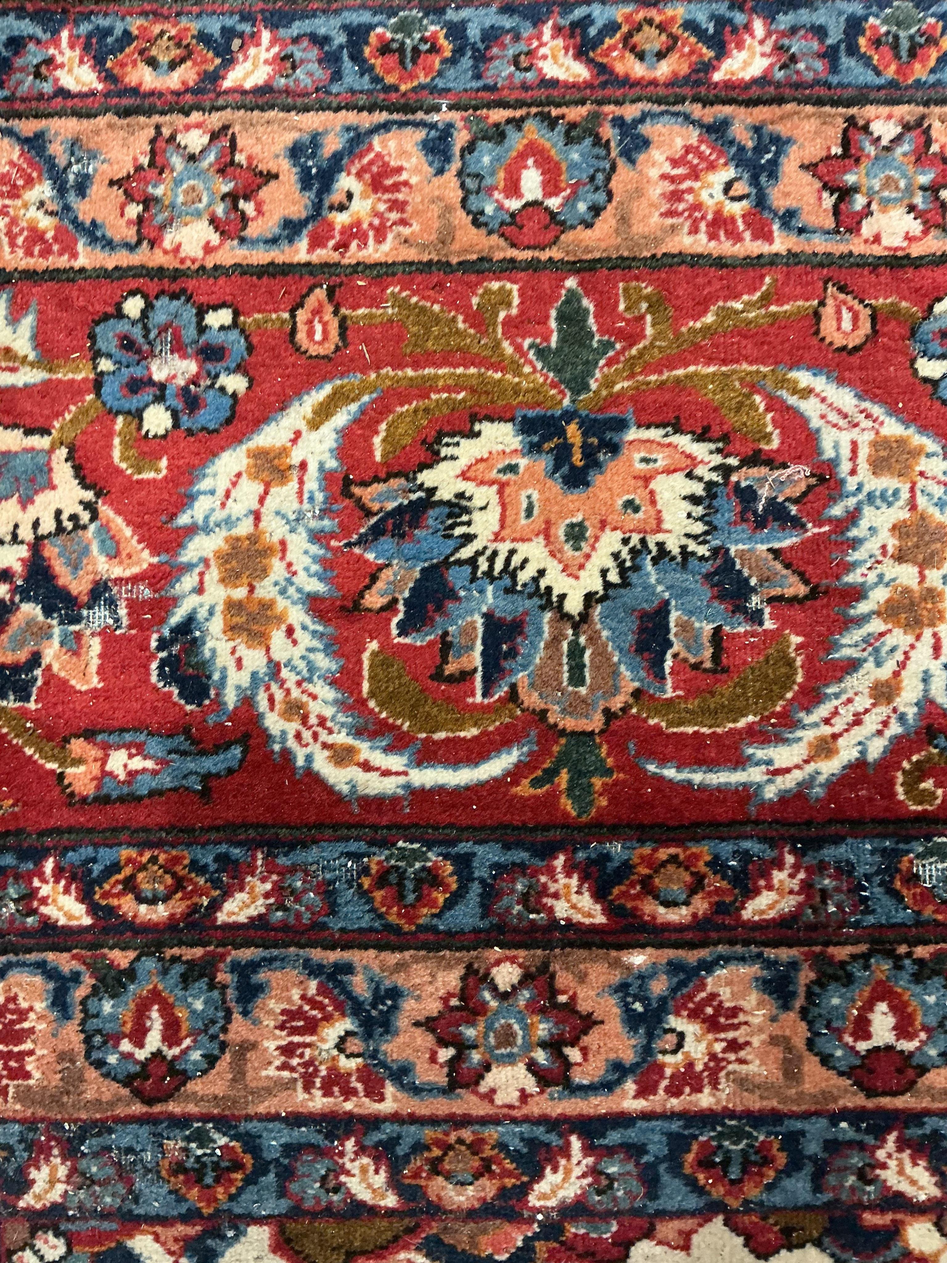 A North West Persian ivory ground floral carpet, 350 x 254cm
